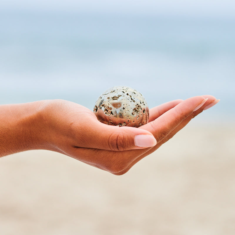 pyrite sphere in hand